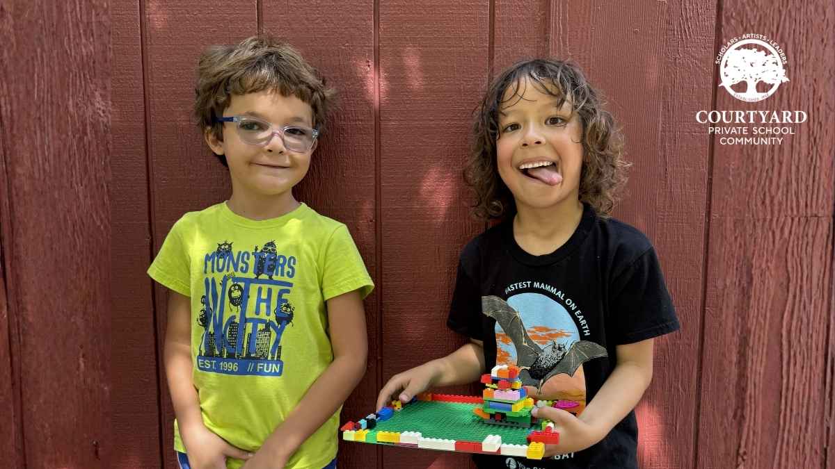 two smiling children in a small school in Sacramento | Courtyard School