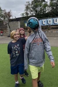 three children having fun at a smaller school in Sacramento | Courtyard School